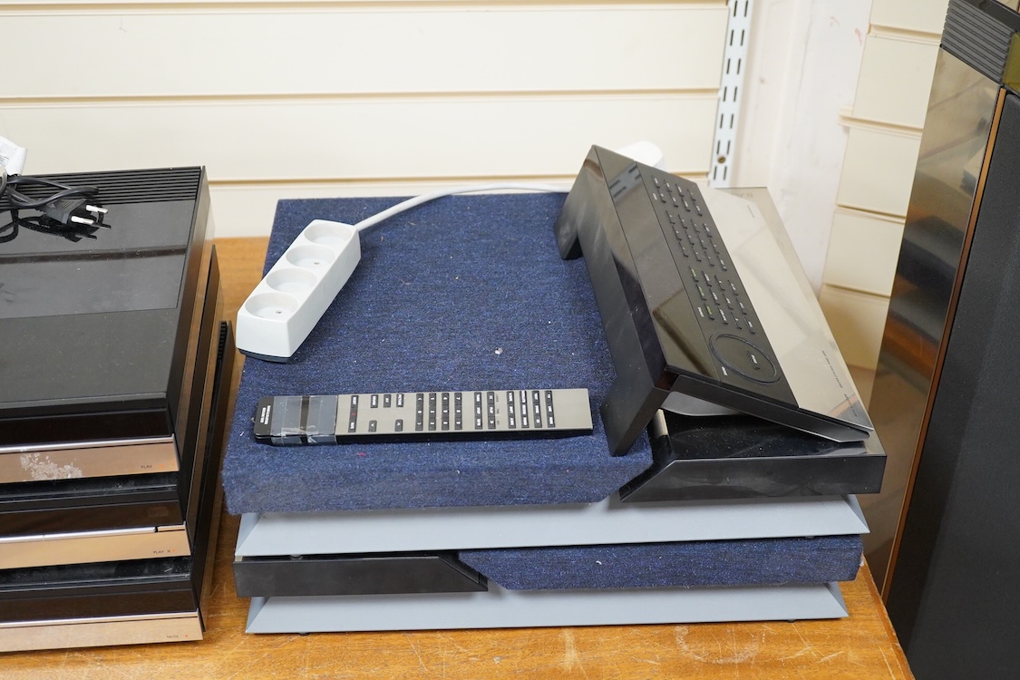 A Bang and Olufsen 6500 hi-fi system, comprising of a Beocord 6500, a Beogram CD 6500, a Beomaster 6500, and a master control panel, together with a pair of floor standing pedestal speakers, 164cm high, and pair of type